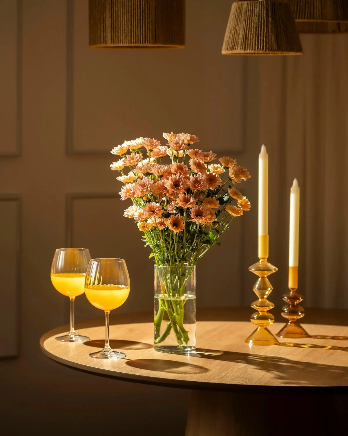 Event table detail with flowers, candles, and glassware